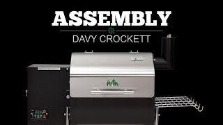 Davy Crockett pellet grill assembly video featuring the grill's sleek design and functional components, highlighting Green Mountain Grills branding.