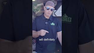 Man in sunglasses and a Green Mountain Grills shirt discussing pellet grilling techniques and tips.