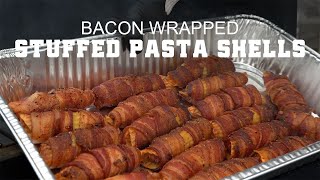 Bacon wrapped stuffed pasta shells in a tray, showcasing a delicious BBQ dish featured in Green Mountain Grills recipes.