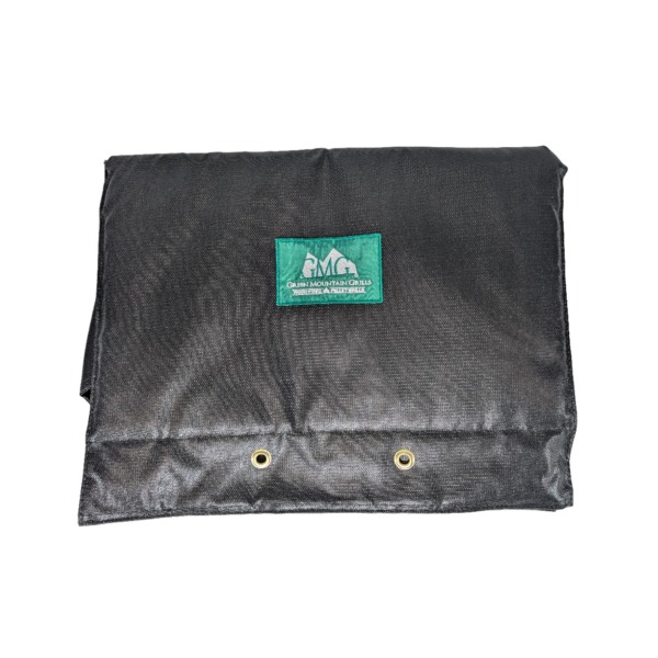 Black thermal blanket for Green Mountain Grills with logo, designed for DC and Trek models, featuring grommets for secure attachment.