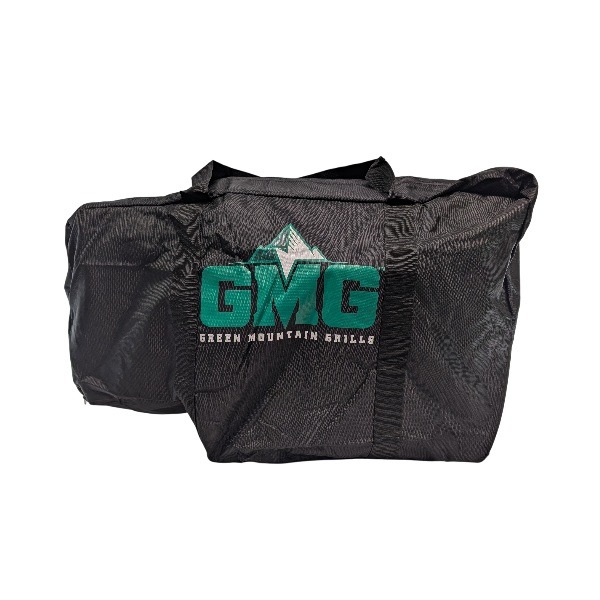 Black Trek Tote Bag by Green Mountain Grills featuring "GMG" logo and mountain graphic, designed for outdoor grilling enthusiasts.